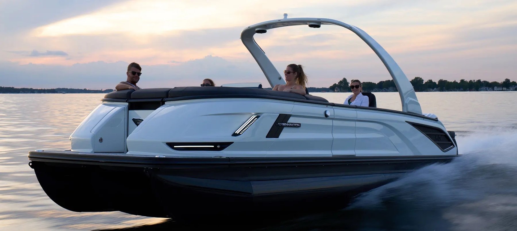 Bennington QX Series luxury pontoon on the water